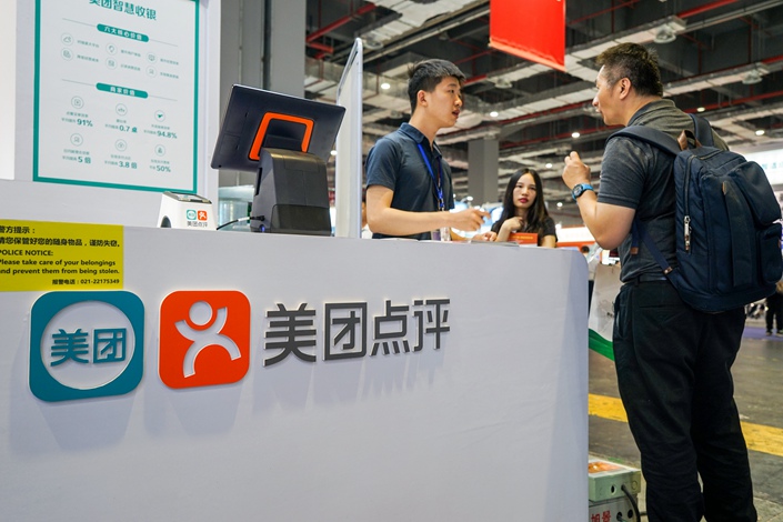 On-demand services provider Meituan-Dianping hosts a booth during an expo in Shanghai on May 14. Photo: VCG