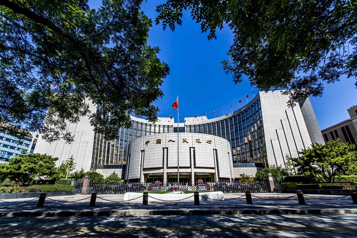 A member of the monetary policy committee of China’s central bank (pictured) says that regulators will avoid a “one-size-fits-all” approach to deleveraging. Photo: VCG