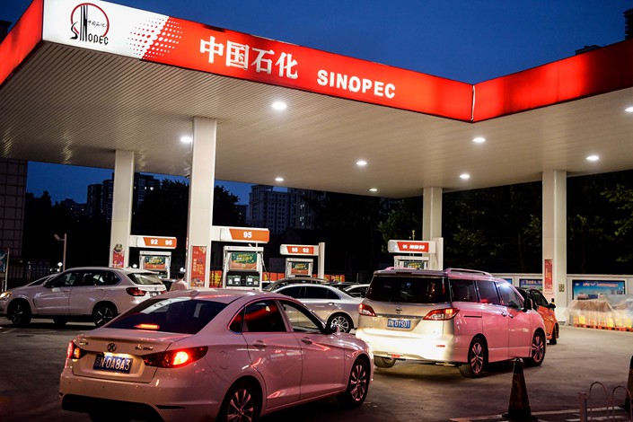 Cars wait to fill up at a Sinopec gas station in Beijing on July 9. Photo: IC