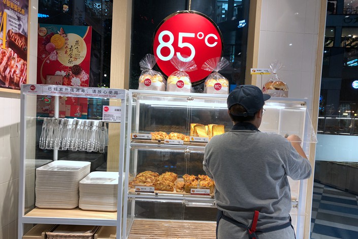An 85C Bakery Café is seen in the Sanlitun area of downtown Beijing on Friday. Photo: Wu Gang/Caixin