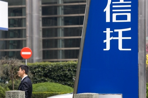 Chinese regulator has been stepping up scrutiny of trust companies to curb off-balance sheet lending activities. Photo: VCG
