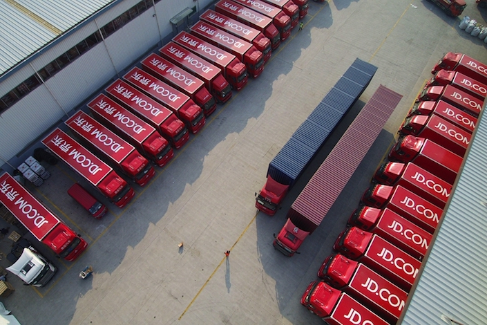 Delivery trucks parked outside a JD.com warehouse. Photo: VCG