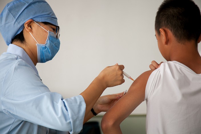 A middle school student gets vaccinated in Beijing on Sept. 14. Photo: VCG