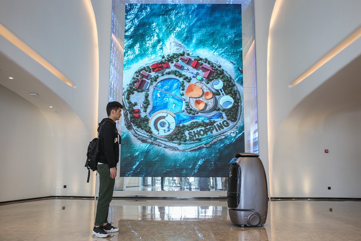 A robot serves a guest on Monday at Alibaba’s futuristic FlyZoo Hotel in the eastern city of Hangzhou. Photo: IC