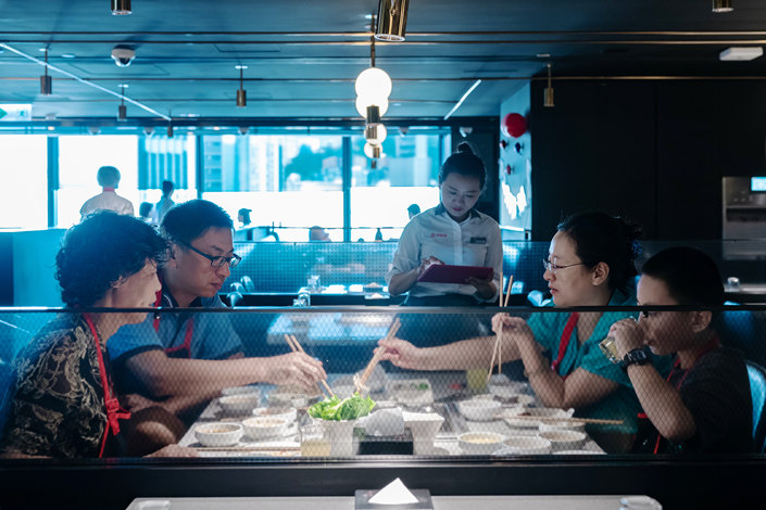 Customers dine at a Haidilao hotpot restaurant in Hong Kong on Sept. 22. Photo: VCG
