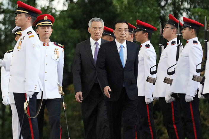 Chinese Premier Li Keqiang (in dark suit on the right) is received by Singapore’s Prime Minister Lee Hsien Loong for a five-day visit. Photo: Xinhua