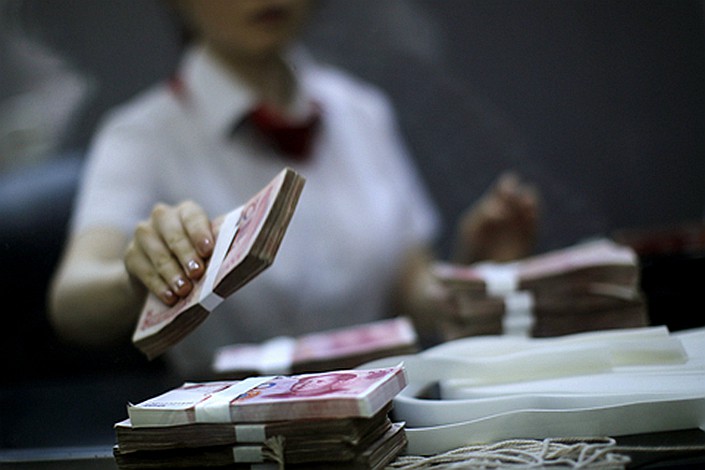 In July, banks extended 1.06 trillion yuan in net new yuan loans, 600 billion yuan less than the previous month. Photo: VCG