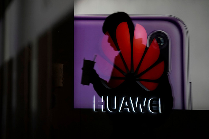 A Huawei smartphone advertisement at a shopping mall in Shanghai on Dec. 6. Photo: VCG