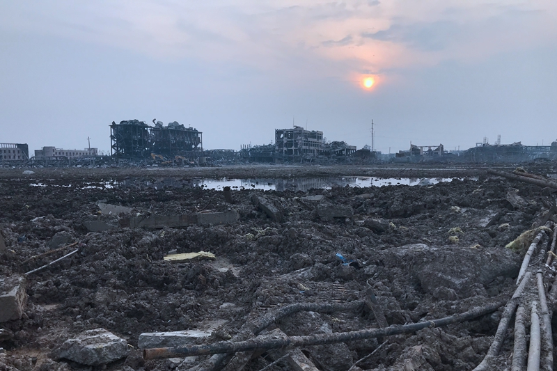 The Xiangshui explosion left a crater measuring 100 meters in diameter. When Caixin reporters visited the site at the end of April, the crater was still filled with a pungent mix of black, green and red liquids.Photo: Yang Rui/Caixin