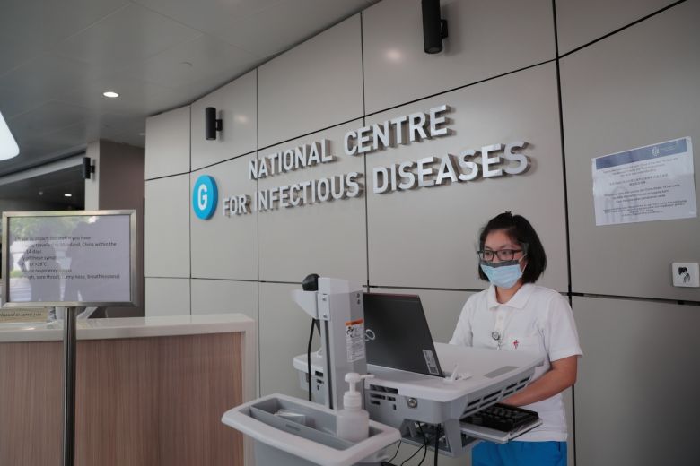 Singapore raises alert level as coronavirus cases jump to 33