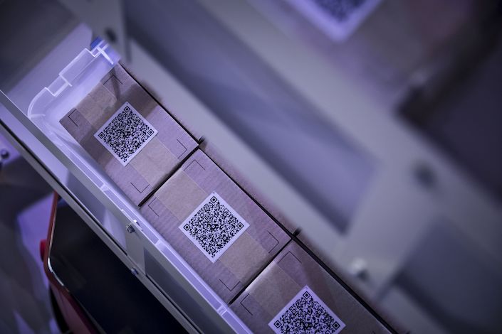Boxes with Quick Response codes sit on display in a booth for Cainiao Smart Logistics Network. Photo: Bloomberg