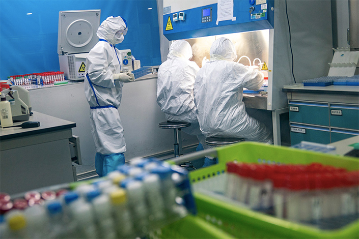 Medical workers prepare nucleic acid tests on Feb. 13 in a laboratory in Wuhan, the epicenter of China’s coronavirus outbreak. Photo: China’s central government
