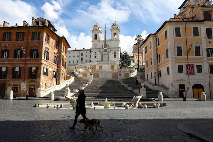 A pedestrian walks past empty Spanish Steps in Rome on March 27. Photo: Bloomberg