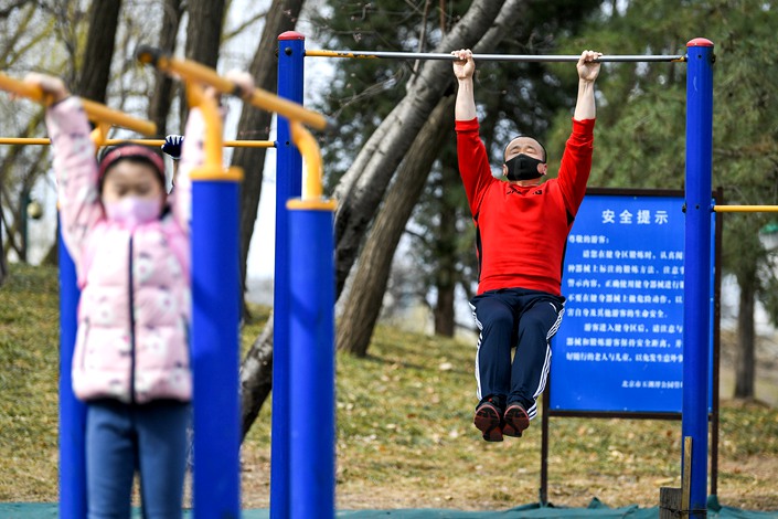 People exercise at a Beijing park on March 12. Photo: IC Photo