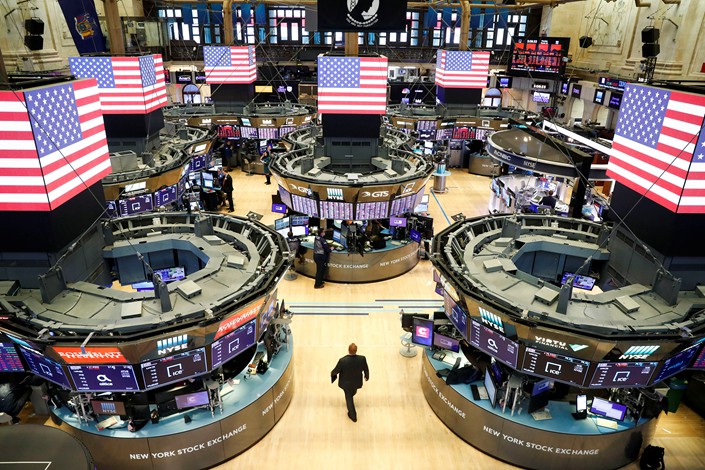 Traders work at the New York Stock Exchange on March 16.