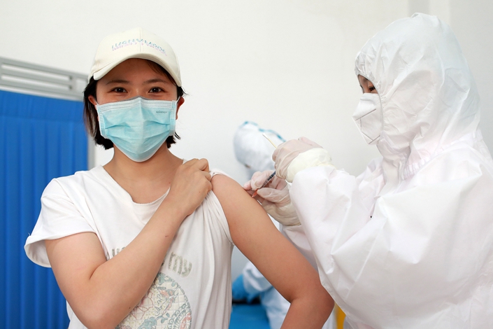 A volunteer in Wuhan participates in the second phase of a coronavirus vaccine clinical trial on April 15.