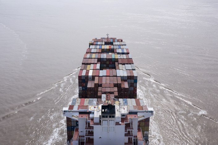 A container ship sails out of Yangshan Deepwater Port in Shanghai on March 23.  Photo: Bloomberg