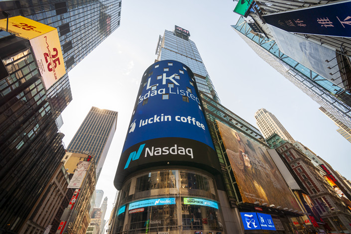 The giant video screen of the Nasdaq stock exchange in Times Square in New York decorated for the debut of Luckin Coffee’s initial public offering in 2019.