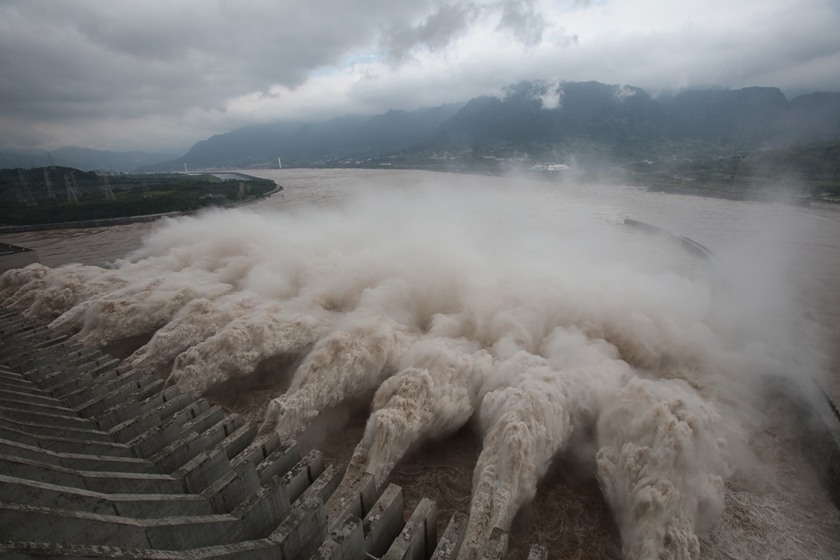 FILE--Floodwaters gush out of the Three Gorges Dam during a flood