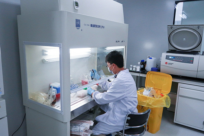 A scientist works in Zai Lab's drug development laboratory in Shanghai in October 2018.