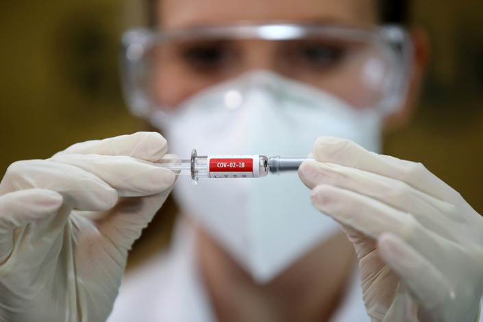 A nurse holds a vial of a Covid-19 vaccine candidate in Porto Alegre, Brazil, on Aug. 8.