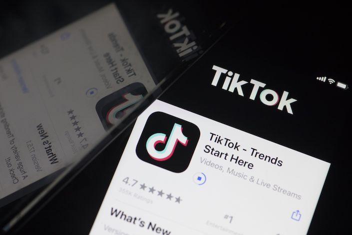 The download page for ByteDance Ltd.'s TikTok app is arranged for a photograph on a smartphone in Sydney