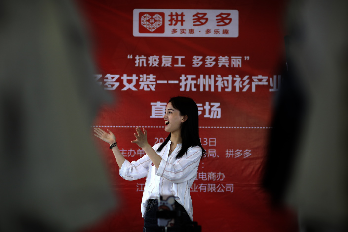 A host introduces products that will be sold on e-commerce platform Pinduoduo during a livestreaming event on April 13 in Fuzhou, East China's Jiangxi province.