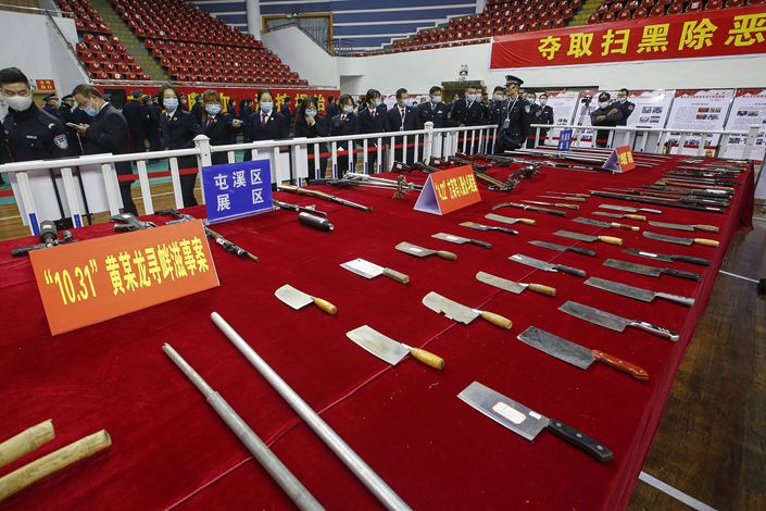 Tools and other objects used to commit crimes sit on display on Dec. 11 at an exhibition of anti-gang activities in Huangshan, East China’s Anhui province. Photo: VCG