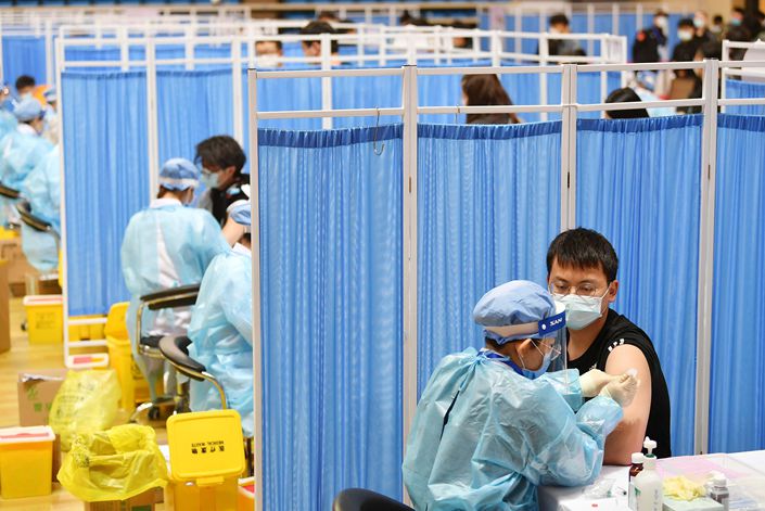 Residents receive coronavirus vaccinations Saturday at an inoculation site in Beijing’s  Haidian district. Photo: VCG