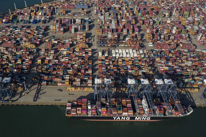 A Yang Ming Marine Transport Corp. container ship sits anchored at the Yantian International Container Terminals