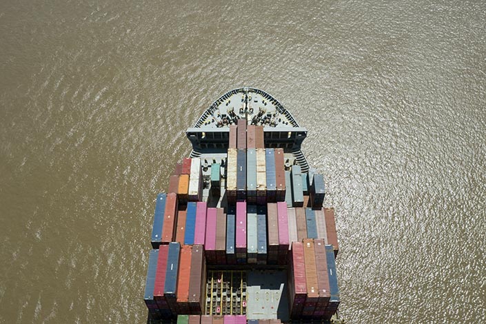 Container ship sails near the Yangshan Deepwater Port in Shanghai on April 9, 2021. Photo: Bloomberg