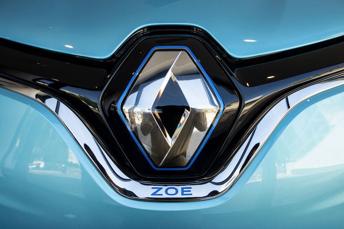 A badge on a Renault Zoe R135 electric automobile. Photographer: Benjamin Girette/Bloomberg