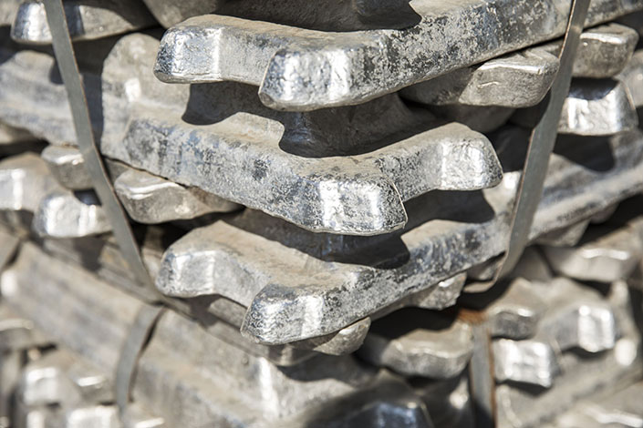 Bundles of aluminum ingots sit stacked on the side of a road near a China National Materials Storage and Transportation Corp. stockyard in Wuxi, East China Jiangsu province, in August 2018. Photo: Bloomberg