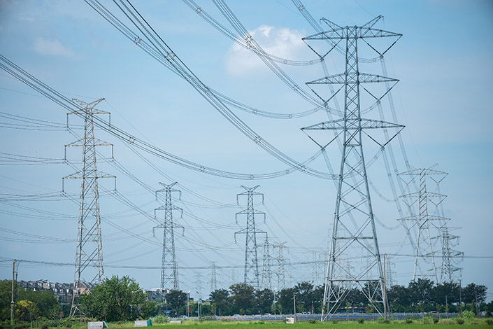Wires run from one high-voltage power transmission tower to another in Shanghai on Aug. 29. Photo: VCG