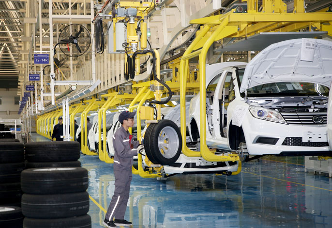 Workers assemble electric vehicles at a factory in Central China’s Henan province in November 2019. Photo: VCG