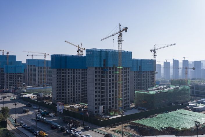 New-home sales by China’s top 100 developers fell 32% from a year earlier in October, according to China Real Estate Information Corp