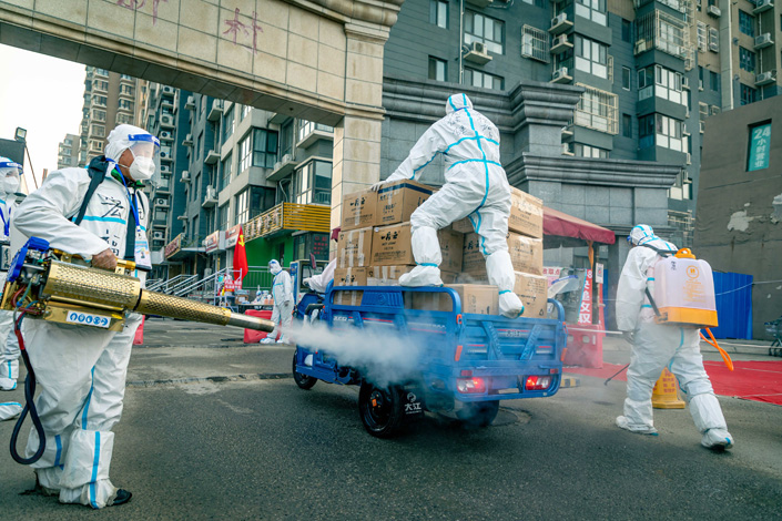Workers disinfect a vehicle transporting daily necessities in Beijing’s Changping district on Friday. Photo: VCG