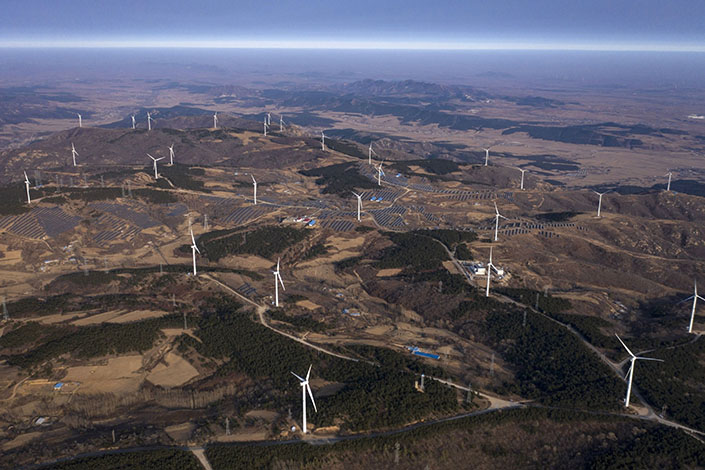 Wind turbines and solar panels near Fuxin, Liaoning province on Nov. 16. Photo: Bloomberg