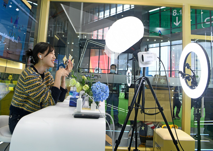 A livestreamer promotes products at the China International Import Expo in Shanghai.