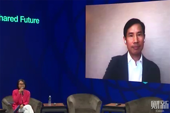 Fred Hu, economist and founder of Primavera Capital Group, attends a session about investing in China via video link. Photo: Caixin
