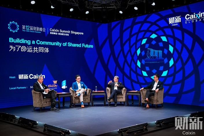 Panelists discuss regulating big tech and big data Friday with moderator Chia Kim Huat, the regional head of Rajah & Tann Singapore LLP, at the Singapore venue of the Caixin Summit. Photo: Alex Chen
