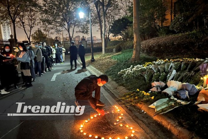 Residents of a community in Wuhan, Central China's Hubei province, lay flowers and lit candles to mourn Lu Xiaolin. Photo: Courtesy of Weibo account of Lu's family