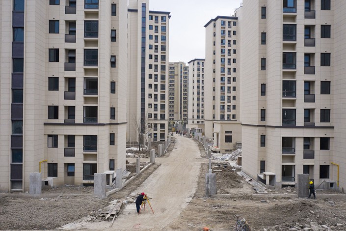 Caption: Chinese developers need to repay some $2.1 billion in offshore bonds in December and $6.1 billion in January. Photo: Bloomberg