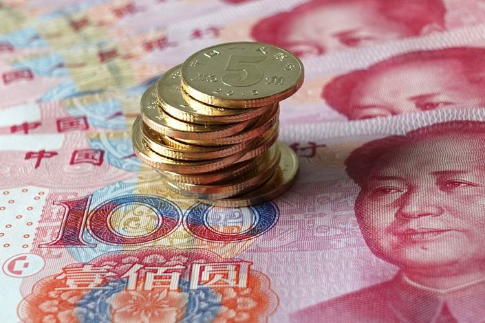 The PBOC says it will lower financial institutions’ reserve requirement ratio by 50 basis points on Dec. 15. Photo: IC Photo