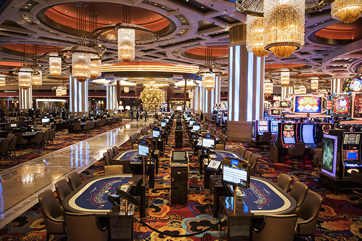 Gaming tables sit at the Studio City casino resort of Melco Resorts & Entertainment Ltd. in Macao in October 2015. Photo: VCG