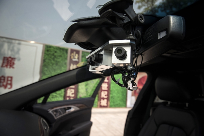 Cameras for SenseTime Group Ltd.'s autonomous driving system are mounted inside a Lincoln Motor Co. MKZ sedan during a test-drive in Hangzhou on Sept. 6, 2018. Photo: Bloomberg