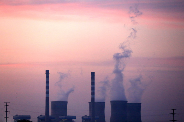 Caption: Smoke billows from the chimneys of a power plant in eastern Jiangsu province's Huai’an in 2018.