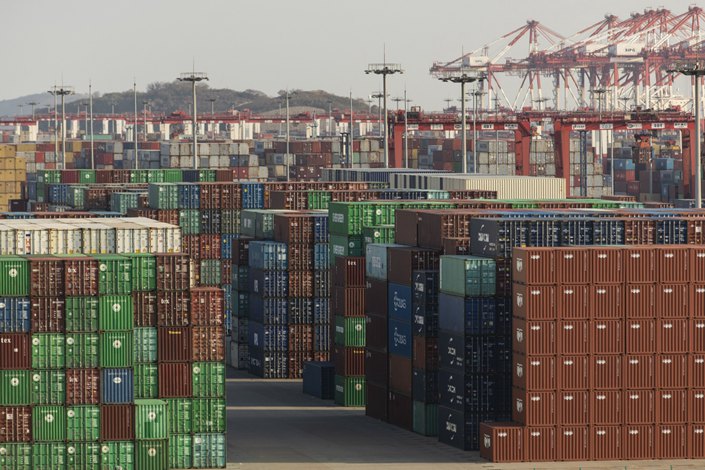 Gantry cranes and shipping containers tower over the Yangshan Deepwater Port in Shanghai on Tuesday. Photo: Bloomberg