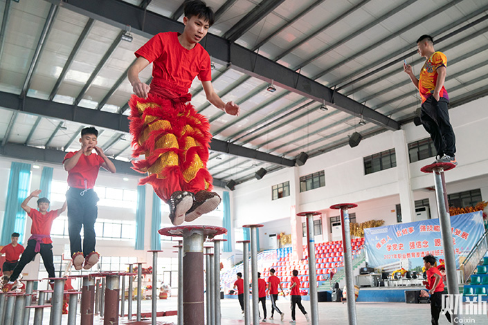 Students train to become lion dancers in January at the Tengxian vocational secondary school in South China’s Guangxi Zhuang autonomous region. Photo: Liang Yingfei/Caixin