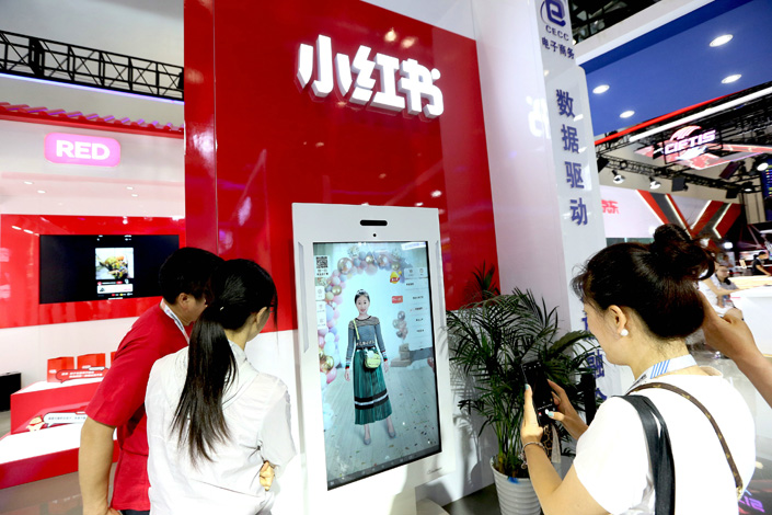 A virtual clothes fitting installation at the Xiaohongshu booth during the Beijing trade fair in May 2019. Photo: VCG